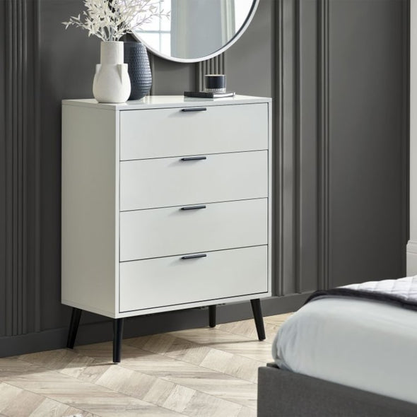 ALBA 4 Drawer Bedroom Chest in Silk Grey. Discover a sleek and modern chest of drawers with tapered black legs and quiet drawers. Ideal for bedroom storage.