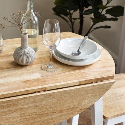 Discover the Small Round Dropleaf Table in White & Natural Oak Effect w/ extendable top in oak effect & white legs. Enhance your dining experience w/ versatile elegance.