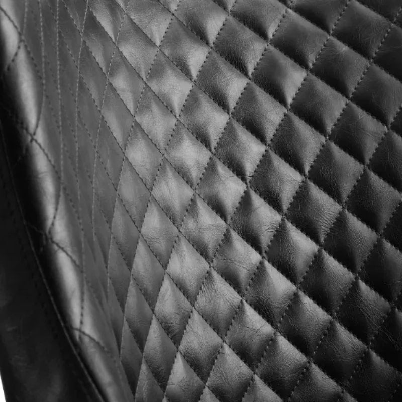 Detailed view of the diamond-quilted backrest of the Luxe Faux Leather Dining Chair, highlighting the stitching and texture.