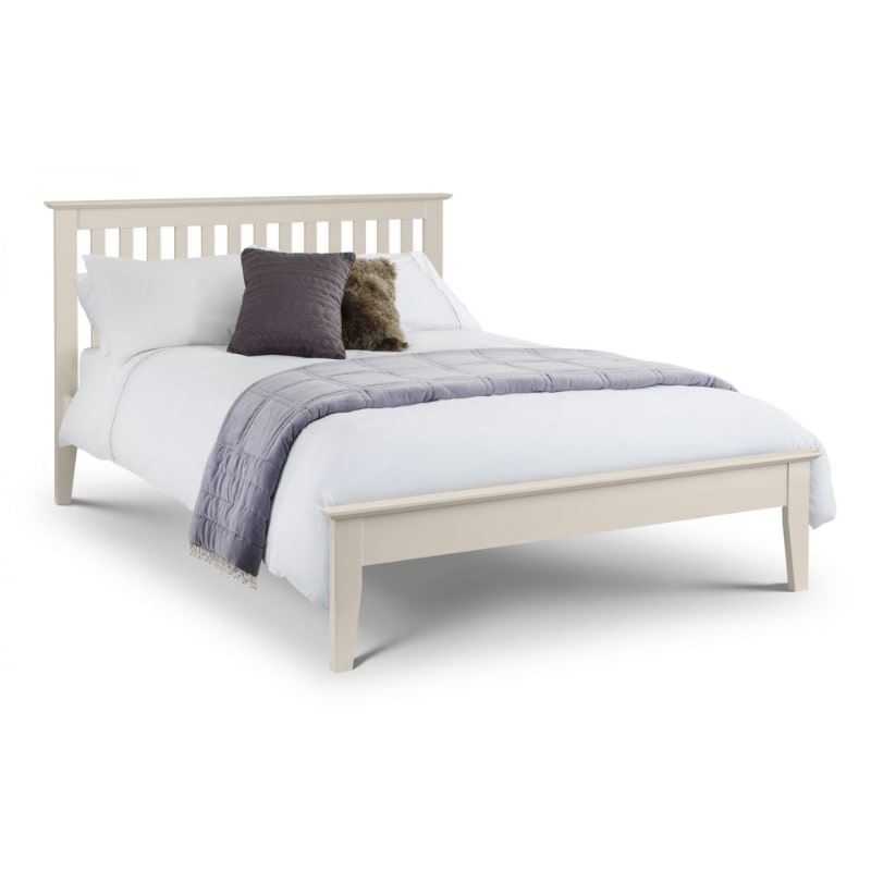 SALERNO solid oak double bed painted in ivory lacquer finish, featuring a slatted headboard and cozy bedding for a stylish bedroom.